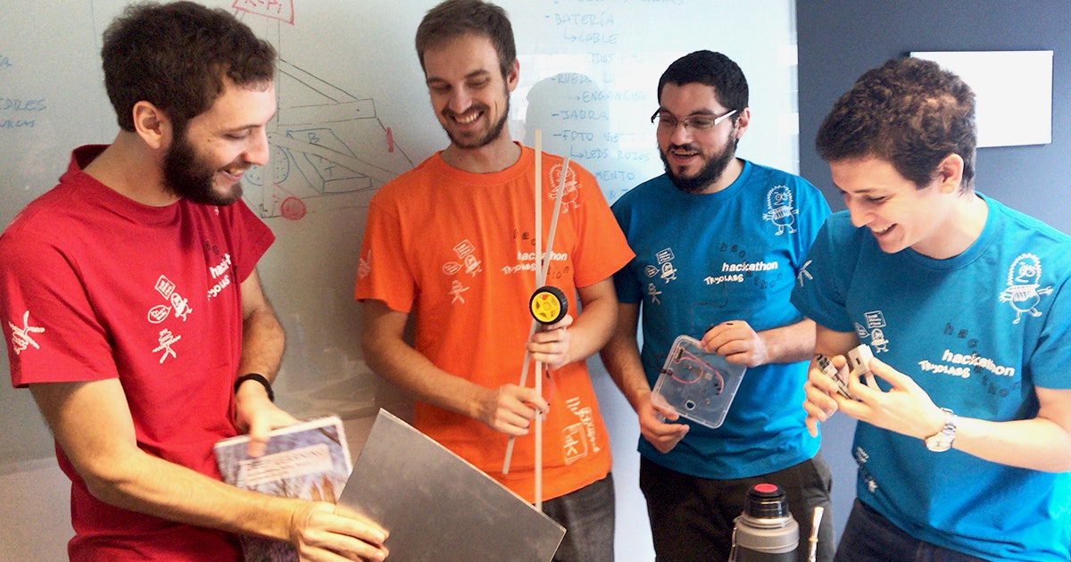 Hackathon team creating robot for remote work